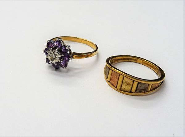 A 9ct gold, amethyst and diamond set nine stone cluster ring, ring size M and a half and a 9ct three colour gold ring, ring size N, combined gross wei