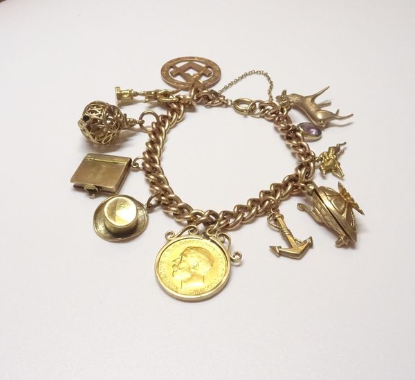 A 9ct gold solid curb link charm bracelet, on a boltring clasp, fitted with eleven charms and pendants, including; a George V half sovereign 1913, a s