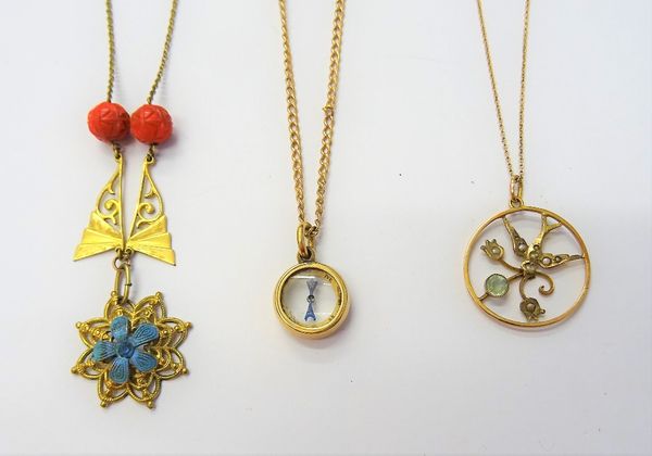 A gold mounted compass pendant, with a gold curb link neckchain, on a cylindrical clasp, a gold, seed pearl and pale blue gem set pendant, with a bird