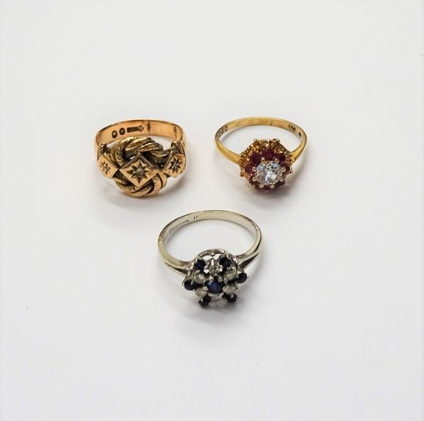 A 9ct gold and diamond set three stone ring, in an interwoven knot shaped design, London probably 1923, a white gold, diamond and sapphire set hexagon