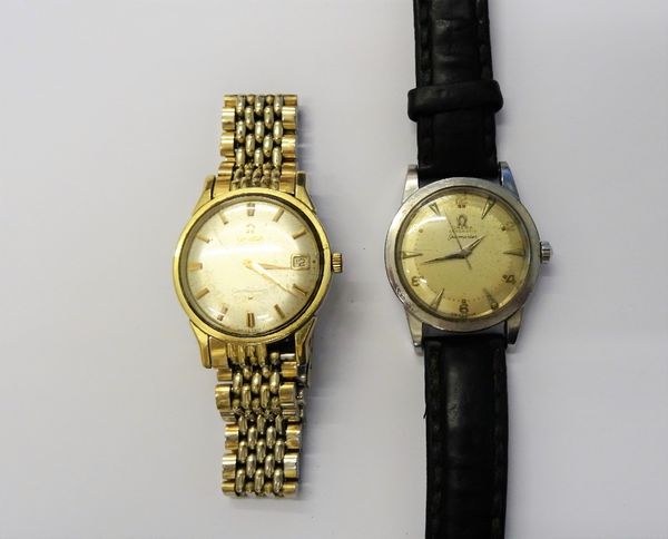 An Omega Automatic Constellation gilt metal fronted and steel backed gentleman's bracelet wristwatch, the signed silvered dial with gilt baton numeral