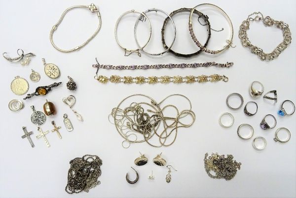 Mostly silver jewellery, comprising; an amethyst set bangle, three further bangles, an amethyst bracelet, three further bracelets, fifteen neckchains,