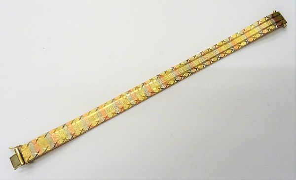 A 9ct three colour gold bracelet, having a textured finish, on a snap clasp, length 18cm, weight 14.7 gms.