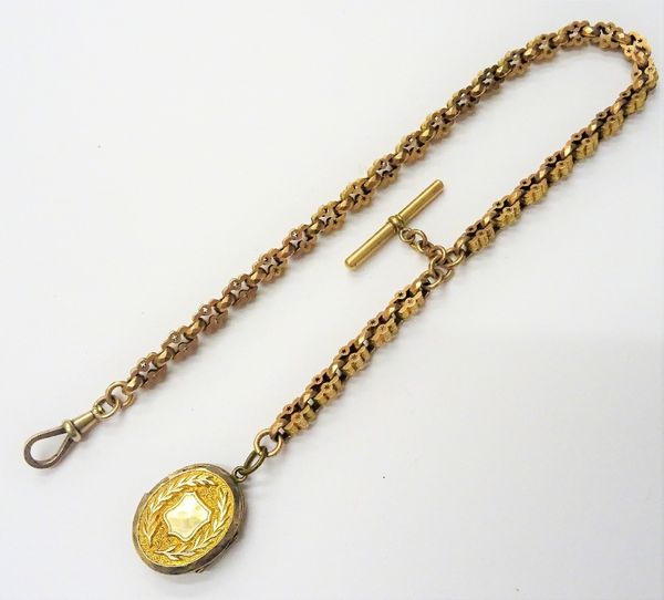 A Victorian gold watch Albert chain, in a shaped rectangular and star pierced link design, detailed 9 C, fitted with a safety chain, a T bar and with