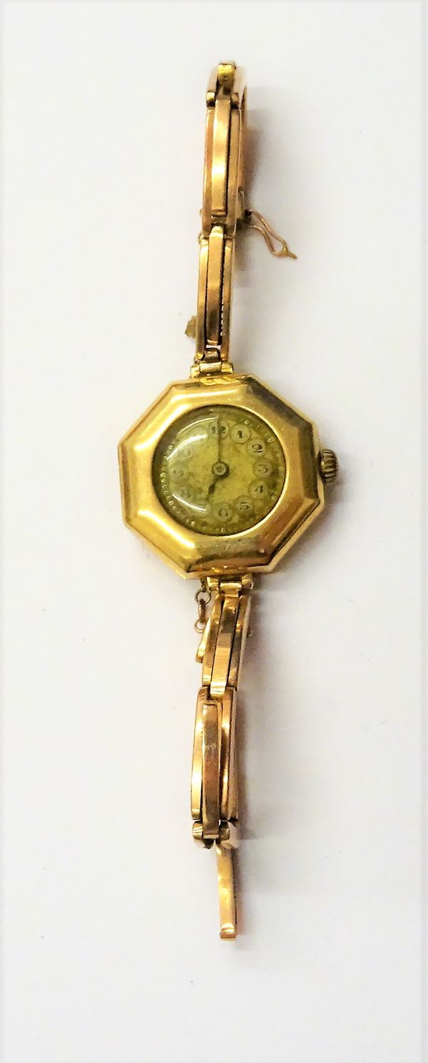 A Rolex gold octagonal cased lady's wristwatch, the jewelled lever movement detailed Rolex 15 Jewels, Swiss Made, the dial with black Arabic numerals,