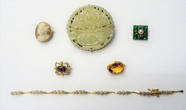 A gold, amethyst and seed pearl set shaped rectangular brooch, detailed 15, a jade brooch, in a carved and pierced circular design, a citrine single s