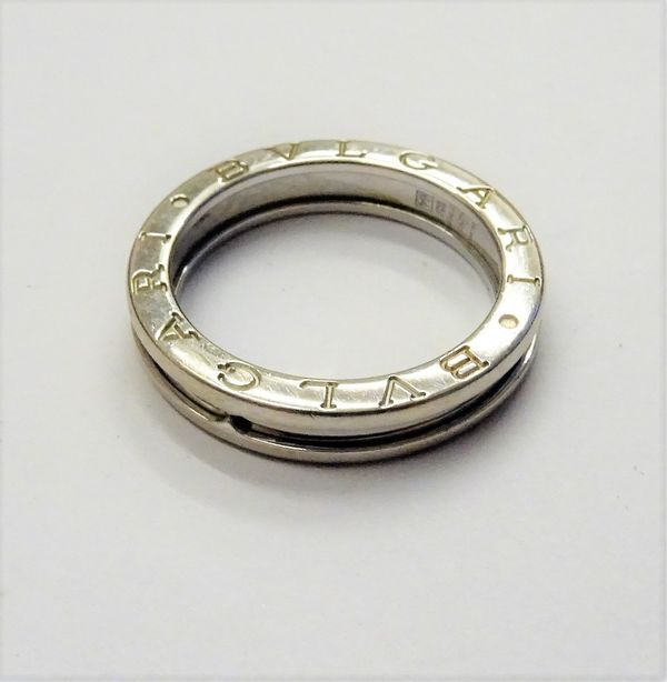 A Bvlgari 18ct white gold band ring, detailed Bvlgari twice to both sides and marked 750 Made In Italy, ring size V, weight 7.8 gms, with a Bvlgari ca