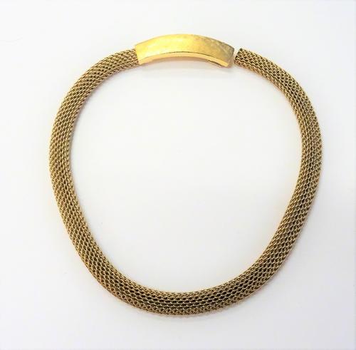 A gold collar necklace, in an interwoven mesh link design, the curved clasp of panel form, having textured decoration, detailed 14 K, weight 50 gms.