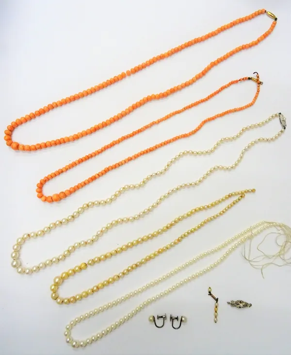 A single row necklace of graduated coral beads, on a snap clasp, another single row necklace of graduated coral beads, a single row necklace of gradua