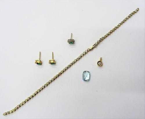 A gold and diamond set bracelet, mounted with a row of circular cut diamonds, on a snap clasp, detailed 585 (broken), length 19cm, a pair of emerald a