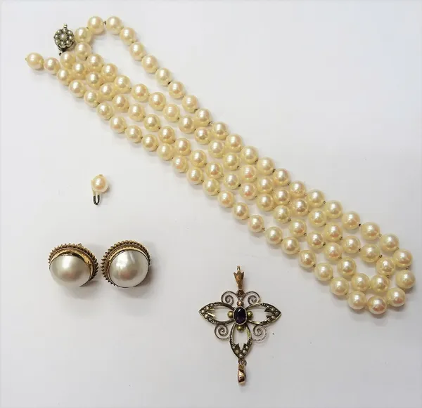A gold, emerald and seed pearl set pendant, in an openwork design, detailed 9 CT, a single row necklace of uniform cultured pearls, on a seed pearl se