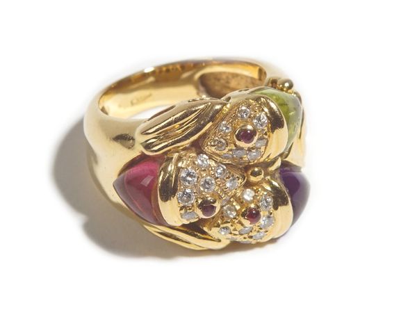 A gold, diamond and cabochon gem set dress ring, designed as three fish heads, set with circular cut diamonds and further set with pink tourmaline, pe