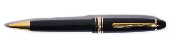A Mont Blanc gilt metal mounted black plastic Mont Blanc Meisterstuck large ballpoint pen, with Service Guide booklet, including warranty stating date