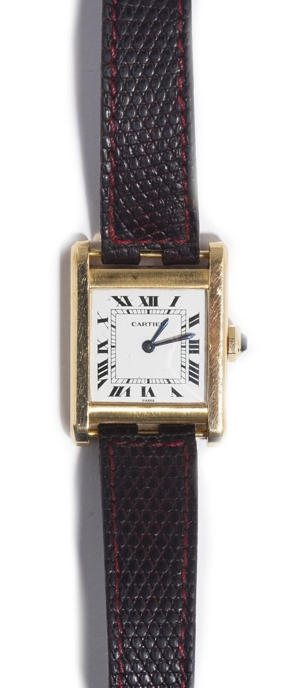 A Cartier Paris 18ct gold rectangular cased tank wristwatch, the signed cream coloured dial with black Roman numerals and with blued steel hands, deta