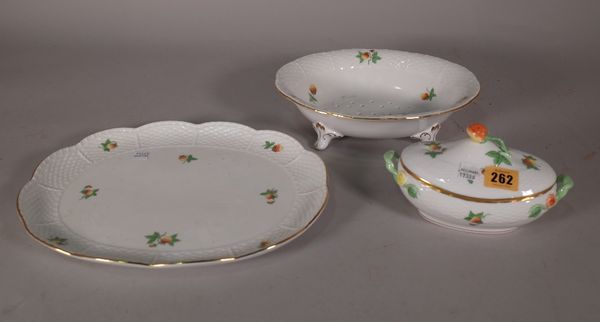 Herend; a group of dinner wares, comprising; oval meat plate, 30cm wide, tureen and cover, 18cm wide and a salad drainer dish, 25cm wide, (3). CAB