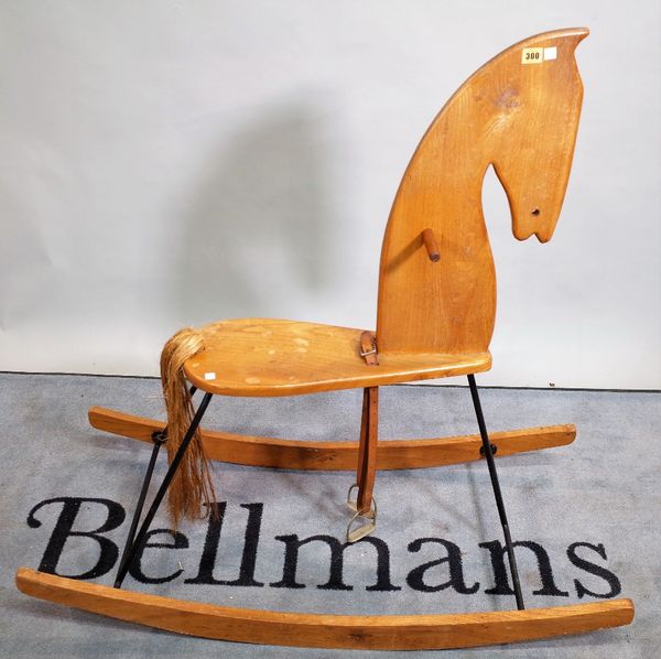 A 20th century elm rocking horse, 113cm wide x 109cm high.  C4