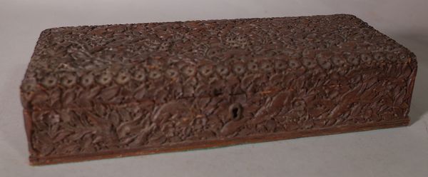 A 19th century Anglo Indian carved sandalwood jewellery box, 29cm wide x 7cm high. CAB