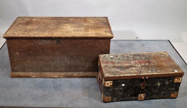 An early 20th century pine trunk, 94cm wide x 44cm high, with a quantity of carpentry tools within and another smaller tool box, 62cm wide x 27cm high