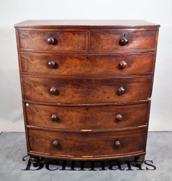 A 19th century mahogany bowfront chest of two short and four long graduated drawers, on turned supports, 108cm wide x 130cm high.  E5