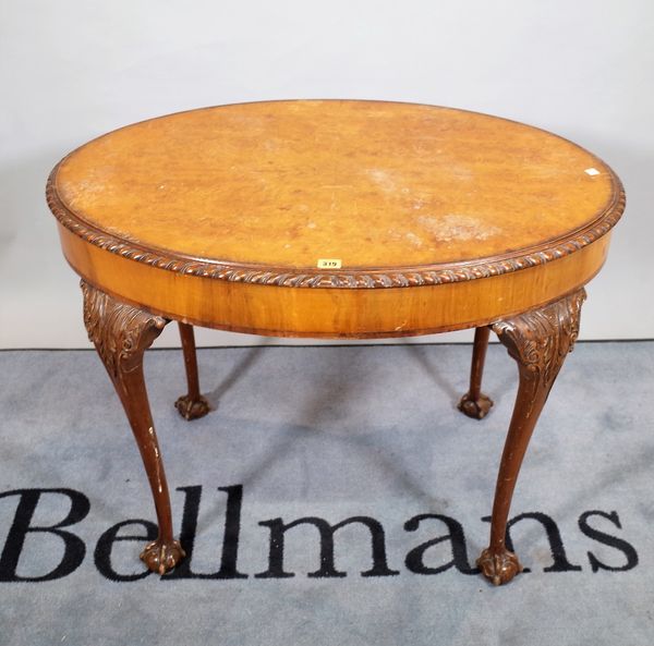 A Victorian style walnut oval centre table on tapering ball and claw supports, 95cm wide x 72cm high.   D1