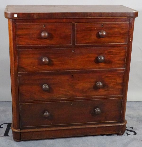 A Victorian mahogany chest of two short and three long graduated drawers on bun feet.   E5