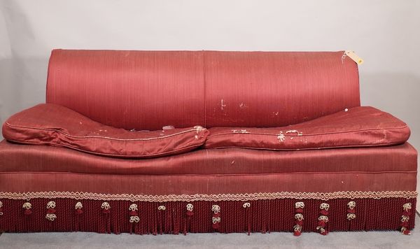 A 20th century hardwood framed red upholstered sofa with gold and red tasseled frieze, 200cm wide x 76cm high.  6309  C3