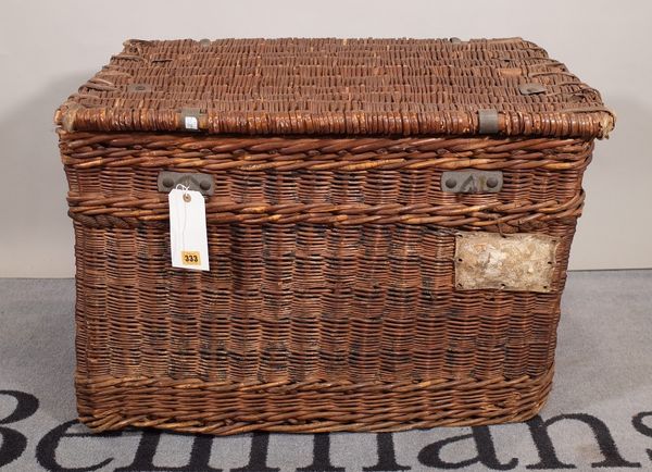 An early 20th century wicker and canvas lined lift top trunk, 79cm wide x 53cm high.  B5