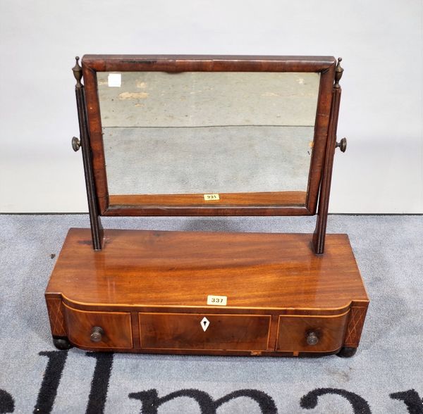 An early 19th century toilet mirror, with bow three drawer base, 55cm wide x 50cm high.