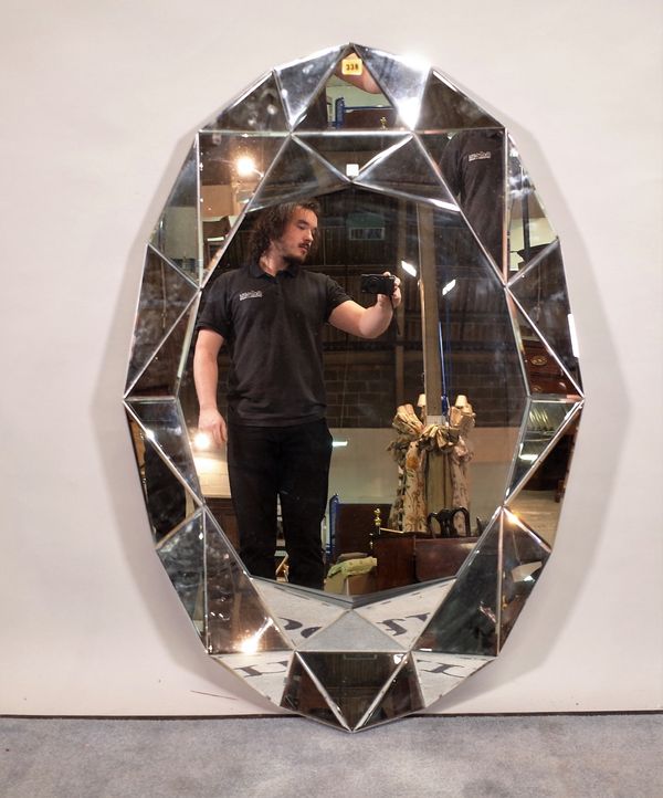 A modern oval geometric pattern mirror, 80cm wide x 120cm high.  E5