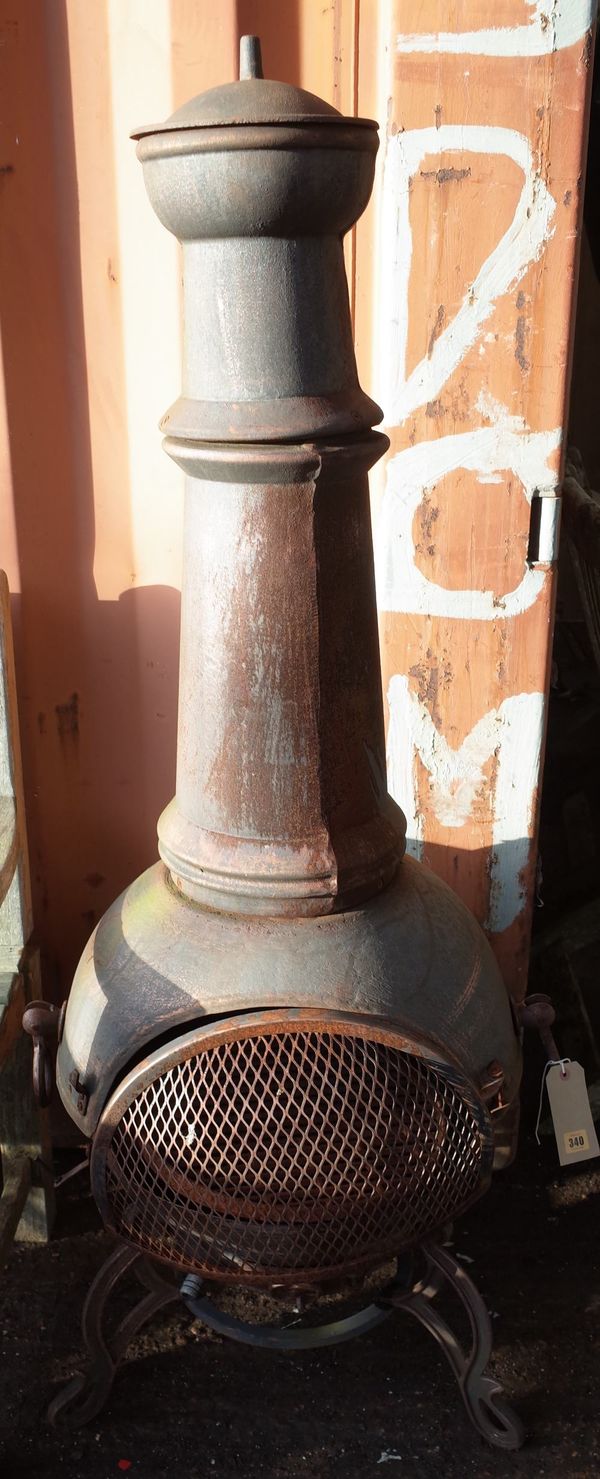 An early 20th century cast iron chiminea, 149cm high.  OUT