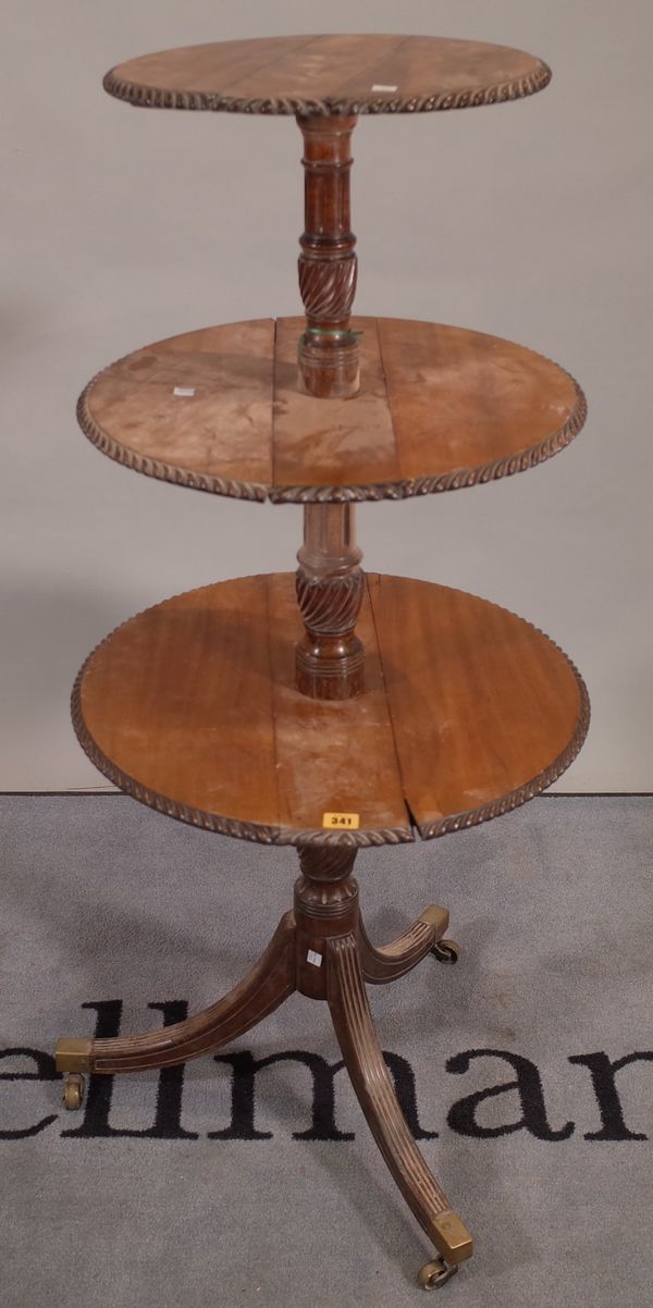 A George III mahogany drop flap three tier dumb waiter on outswept supports, 53cm wide x 120cm high, (a.f.).  E4