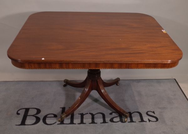 A Regency mahogany breakfast table, the rounded rectangular snap top on four downswept supports, 122cm wide x 74cm high.   C5