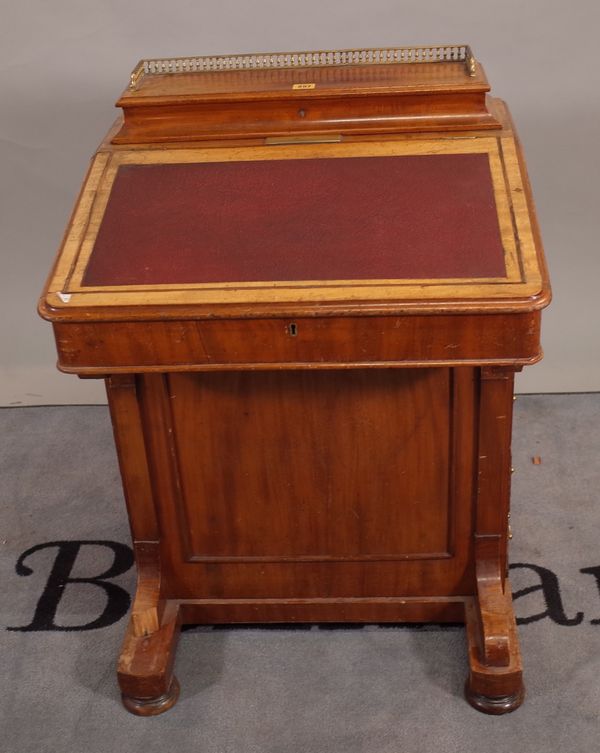 A Victorian mahogany Davenport with fitted galleried super structure over sloped front and four side drawers, 61cm wide x 87cm high.  D4