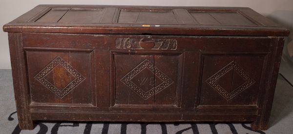 A 17th century coffer with triple panel lid and front, 125cm wide x 51cm high. B1