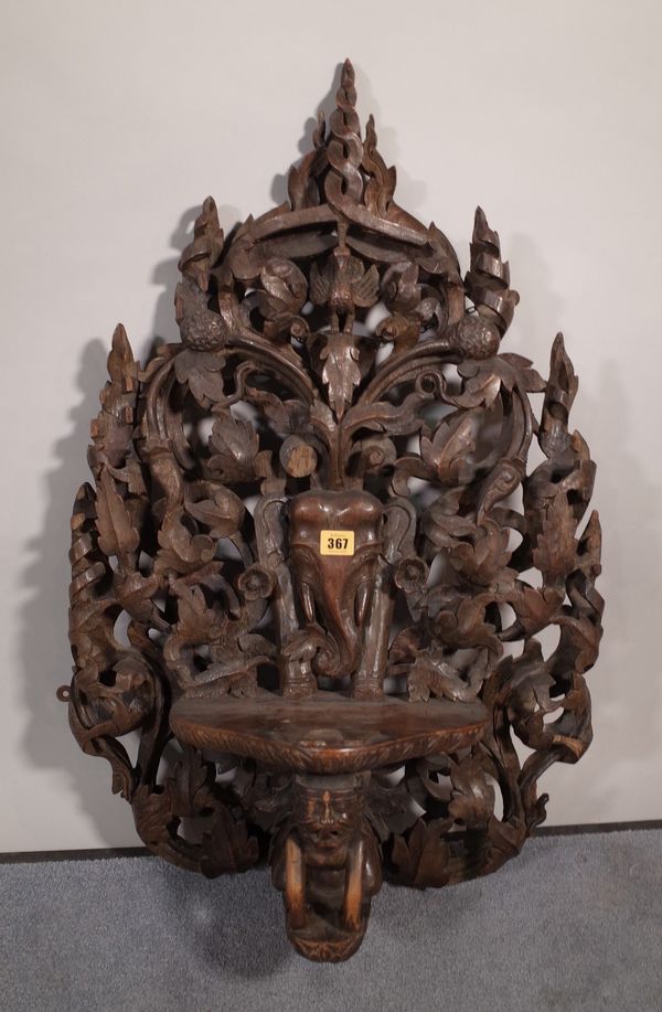 A 20th century carved hardwood hanging shelf, 50cm wide x 75cm high.  B5