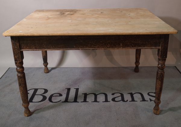 An early 20th century pine kitchen table on black painted turned supports, 120cm wide x 74cm high.  B2