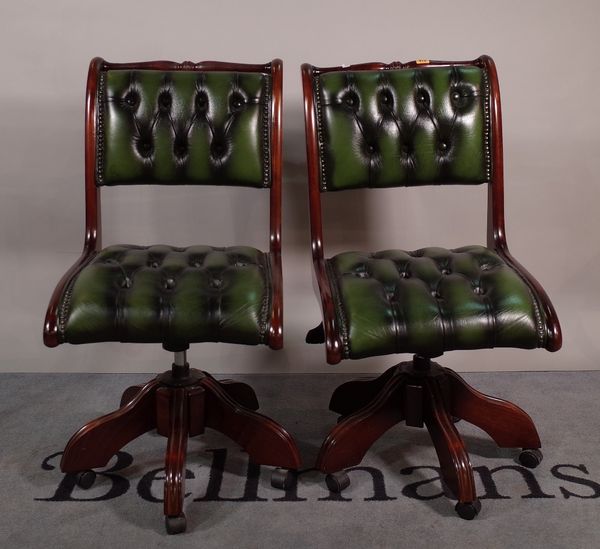 A pair of 20th century office chairs with green button back leather upholstery, 48cm wide x 92cm high, (2).  ROST