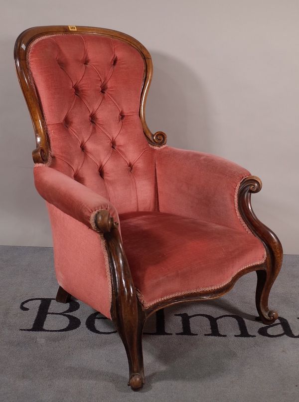 A Victorian mahogany framed low armchair on cabriole supports, 74cm wide x 99cm high.  A1