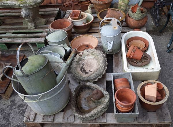 A pair of 20th century terracotta plant pots with swag decoration, 36cm wide x 25cm high, a 20th century reconstituted stone bird bath with stylised d