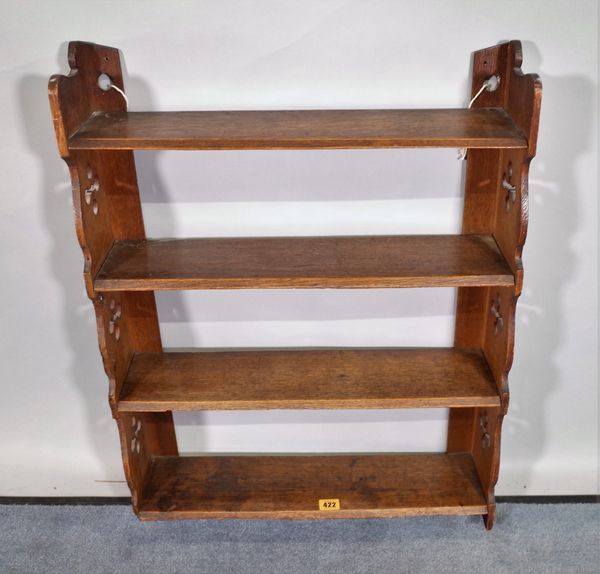 An early 20th century oak four tier hanging shelf, 56cm wide x 72cm high.  E4