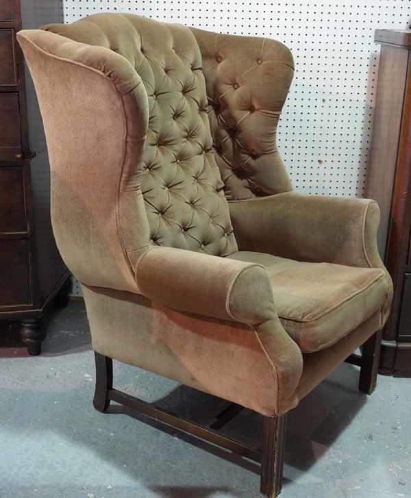 A George II style mahogany framed wingback armchair, on square supports, 84cm wide x 110cm high.  E5