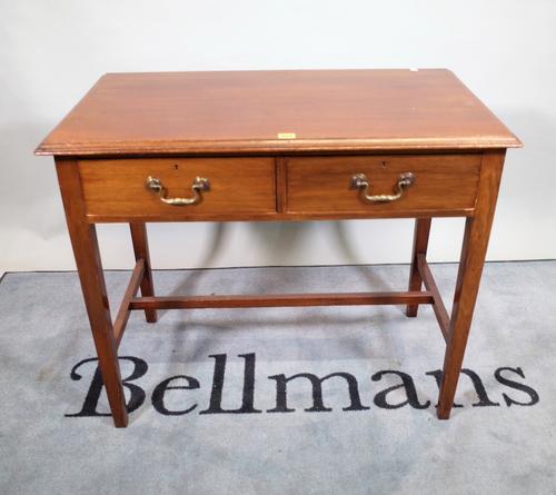An early 19th century mahogany two drawer side table, on tapering square supports, 91cm wide x 78cm high.