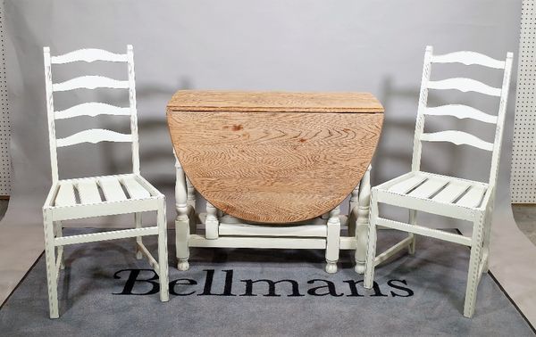 A 20th century white painted oak gate leg table, 92cm wide x 77cm high and a set of four 20th century white painted ladder back dining chairs, 40cm wi