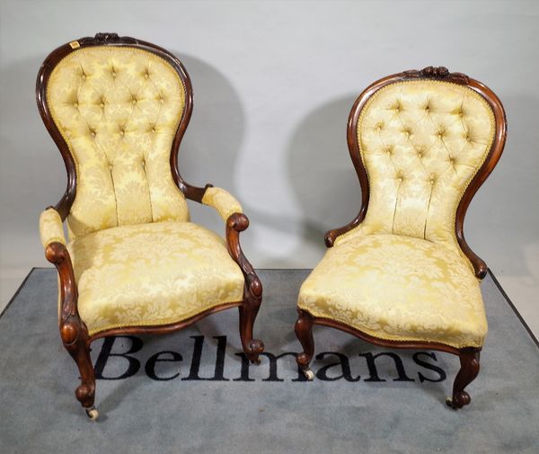 A Victorian mahogany framed gentleman's spoon back armchair, 65cm wide x 103cm high, together with a similar lady's chair, 55cm wide x 93cm high.