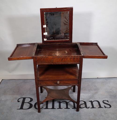 A George III mahogany lift top wash stand with pop up mirror and single drawer, 52cm wide x 82cm high.