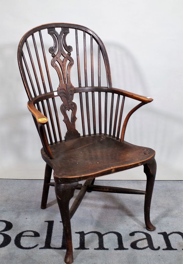 A 19th century yew wood backed Windsor armchair, 63cm wide x 106cm high. E2