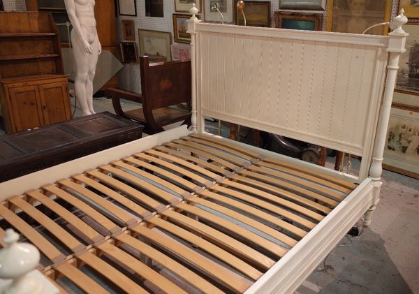 A 20th century white painted double bed, 165cm wide x 140cm high.  B1