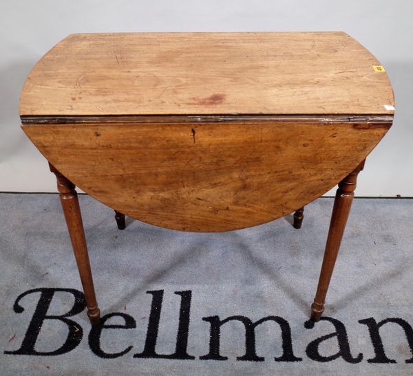 A Regency mahogany oval Pembroke table, with single frieze drawer on turned supports, 81cm wide x 68cm high. D3