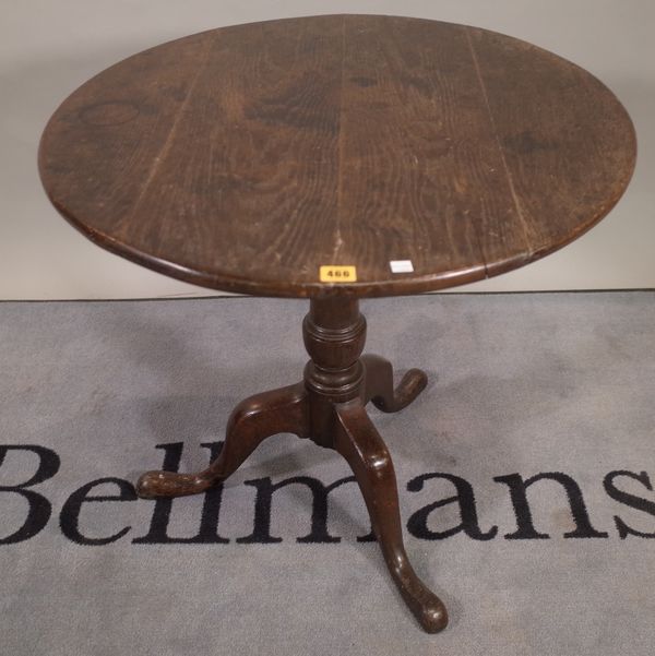 An 18th century oak circular snap top tripod occasional table, diameter 73cm, 69cm high.  E5