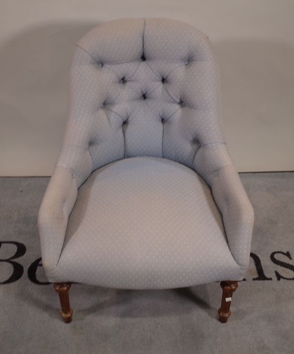 A blue upholstered tub back easy chair on turned and fluted supports, 66cm wide x 82cm high.   D4